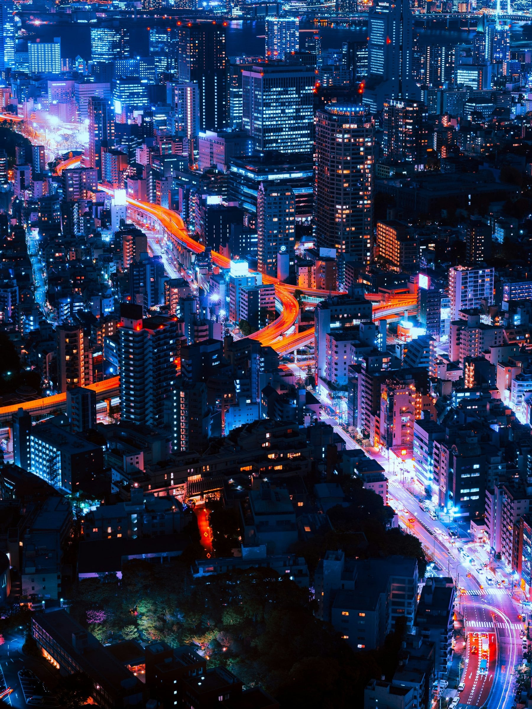 Tokyo at night with light trails on the roads